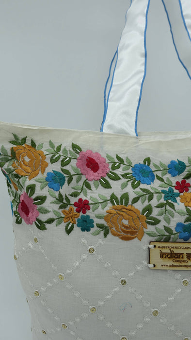Off White Cotton Floral Embroidered Tote Bag With White And Blue Ribbon Handle