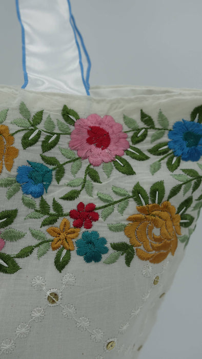 Off White Cotton Floral Embroidered Tote Bag With White And Blue Ribbon Handle