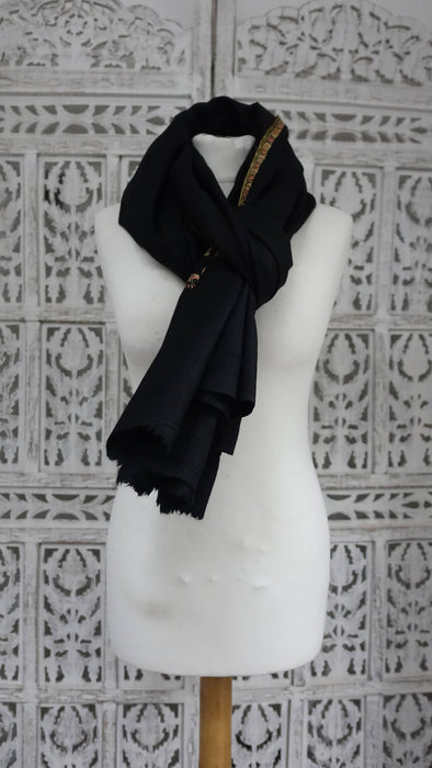 Black wool shawl with pink, green and blue floral embroidery