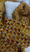 Rusty brown hands and looms woven scarf – close-up of the embellishment