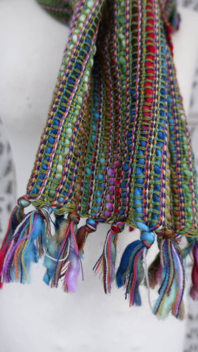 Earthy toned hands and looms woven colourful scarf – border detail