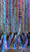 Earthy toned hands and looms woven colourful scarf – pattern detail