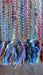 Earthy toned hands and looms woven colourful scarf – fabric and colour detail