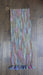 Earthy toned hands and looms woven colourful scarf – shown draped