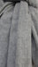 Grey angora wool hands and looms warm scarf – close-up of the embellishment