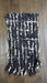 Black and white hands and looms winter scarf – close-up of the embellishment