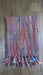 Colourful hands and looms colourful winter scarf – shown draped