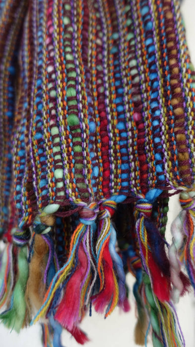 Colourful hands and looms colourful winter scarf – full length view