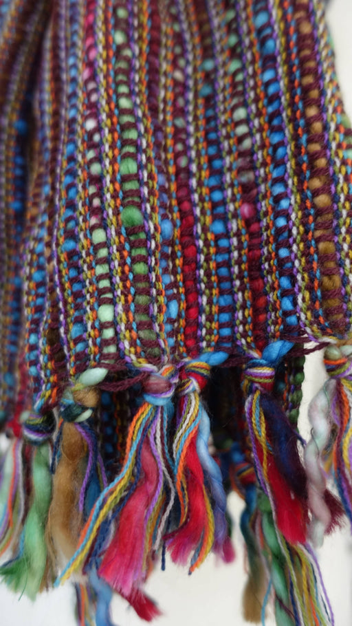 Colourful hands and looms colourful winter scarf – full length view